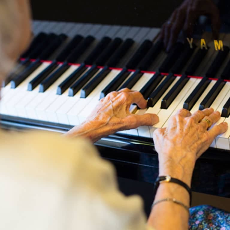 A resident playing the piano