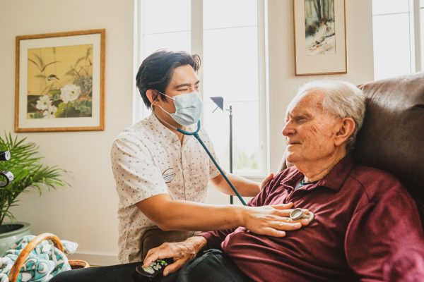 A resident getting checked by a doctor