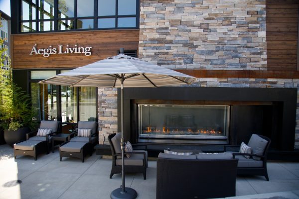 An outdoor seating area with a fireplace