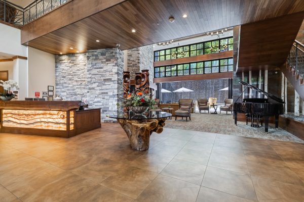 The main lobby, with a desk to the left and a grand piano to the right