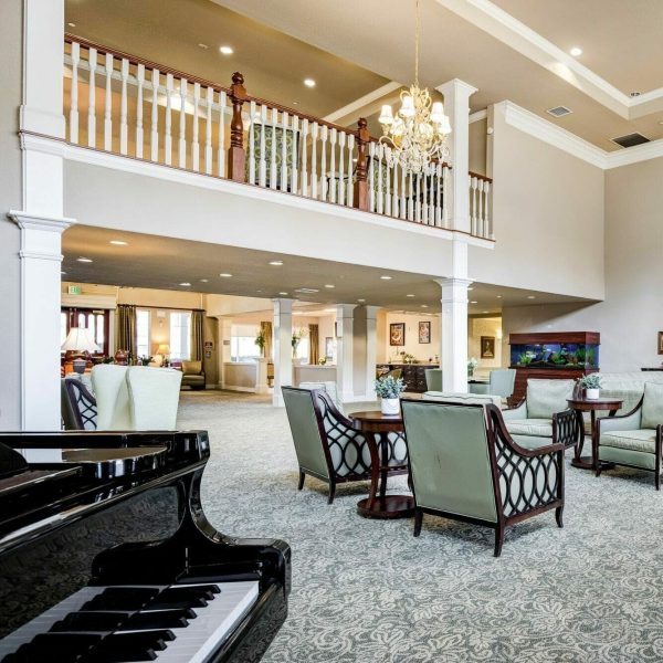 The lobby with a piano and armchairs
