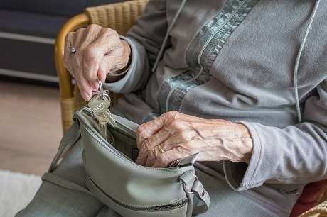 woman looking in purse
