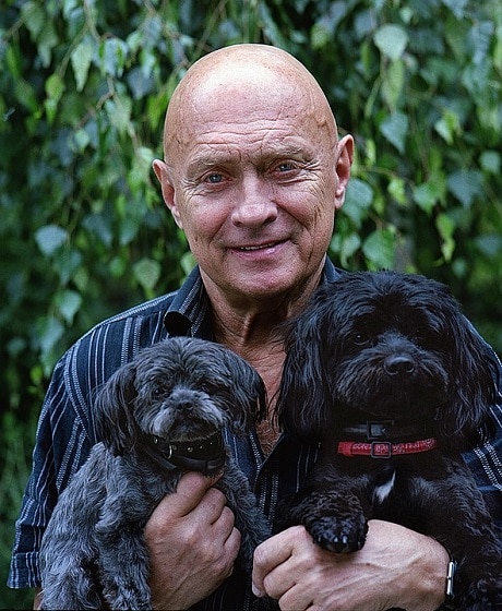 man with two dogs