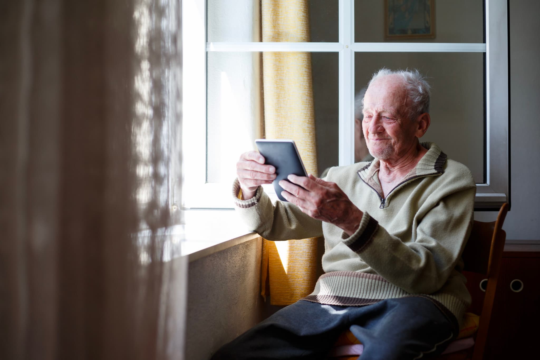 A resident using a tablet